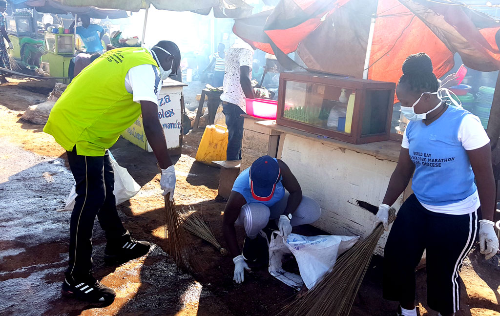 The Ass. DHC Masaka Diocese Fr. Emmanuel with a team of young people cleaning Lyantonde town