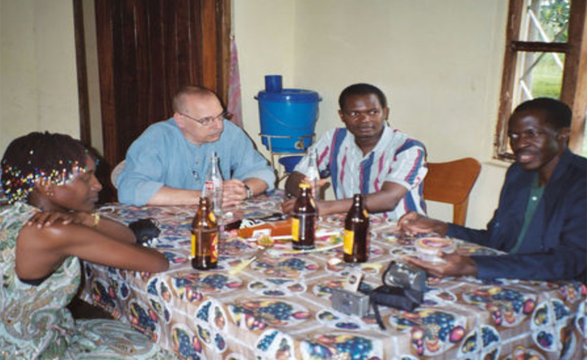 Fr. Ron Sajdak, second from left, was hosted by Fr. Evarist Lubega, far right, on his first visit to Our Lady of Visitation Mbuye Parish in 2005.