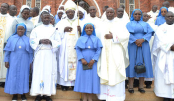 Light moment. Bishop Kaggwa (2nd left) with the bishop-elect, Msgr Serverus Jjumba (2nd right) and other clergy after mass at Kitovu Cathedral on March 24. PHOTO BY GERTRUDE MUTYABA